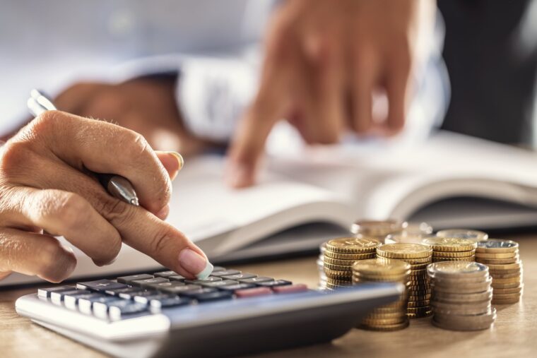 Man and woman hand consider on calculator expenses