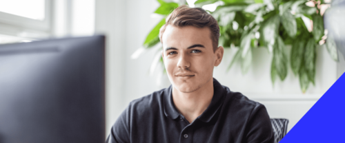 graphics male sitting in office at computer working student