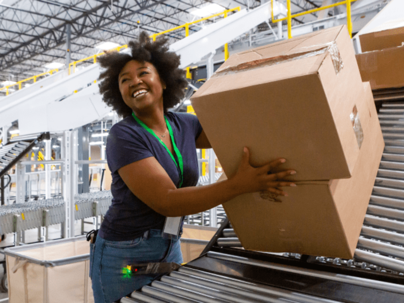 As a shelf stacker, you may have to lift heavy boxes, just like the young woman in this image.