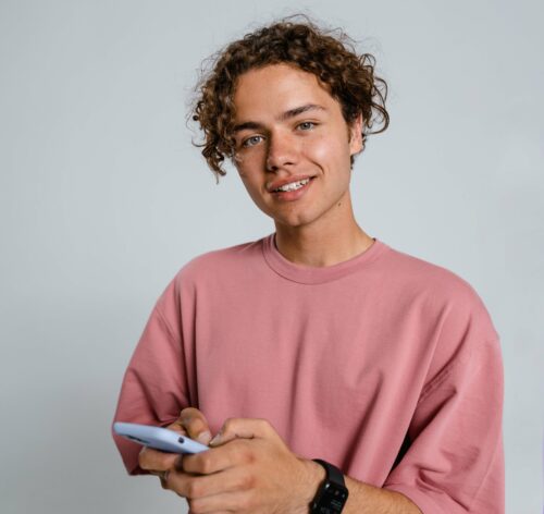 Young man holding a phone